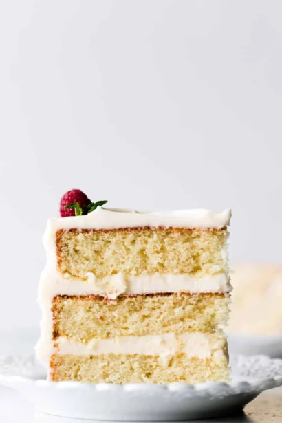 Delicious homemade vanilla cake with creamy frosting and fresh berries