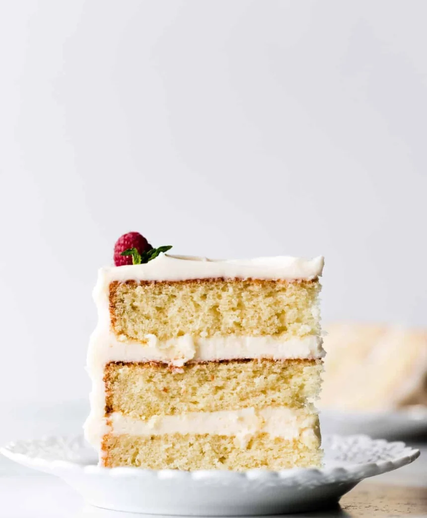 Delicious homemade vanilla cake with creamy frosting and fresh berries