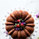 Delicious cream cheese pound cake on a white plate.