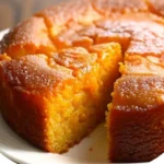 Delicious slice of Grandma's Famous Sweet Potato Butter Cake on a plate
