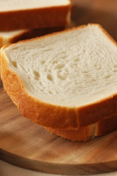 Homemade gluten-free sandwich bread recipe showcasing a fluffy loaf sliced for sandwiches.