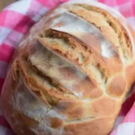 Freshly baked no-knead artisan bread with a crusty exterior and soft interior.