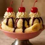 Delicious Banana Split Trifle with layers of bananas, whipped cream, and chocolate